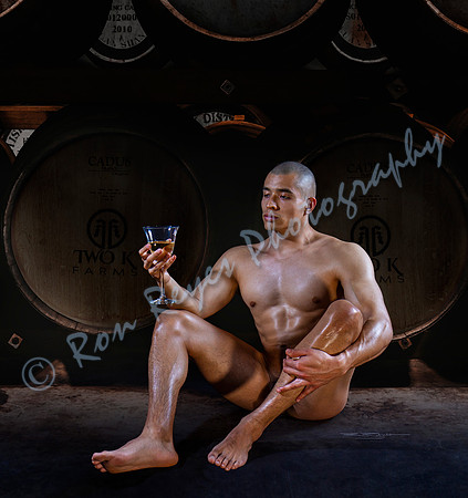 00Z1H_ Omar Drinking White Wine in Cellar